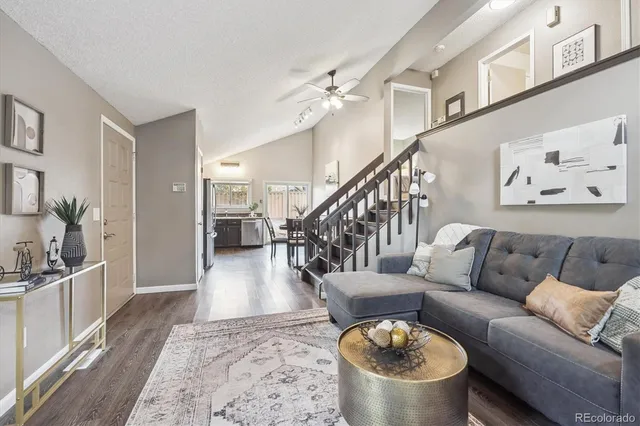 a living room with furniture and a rug