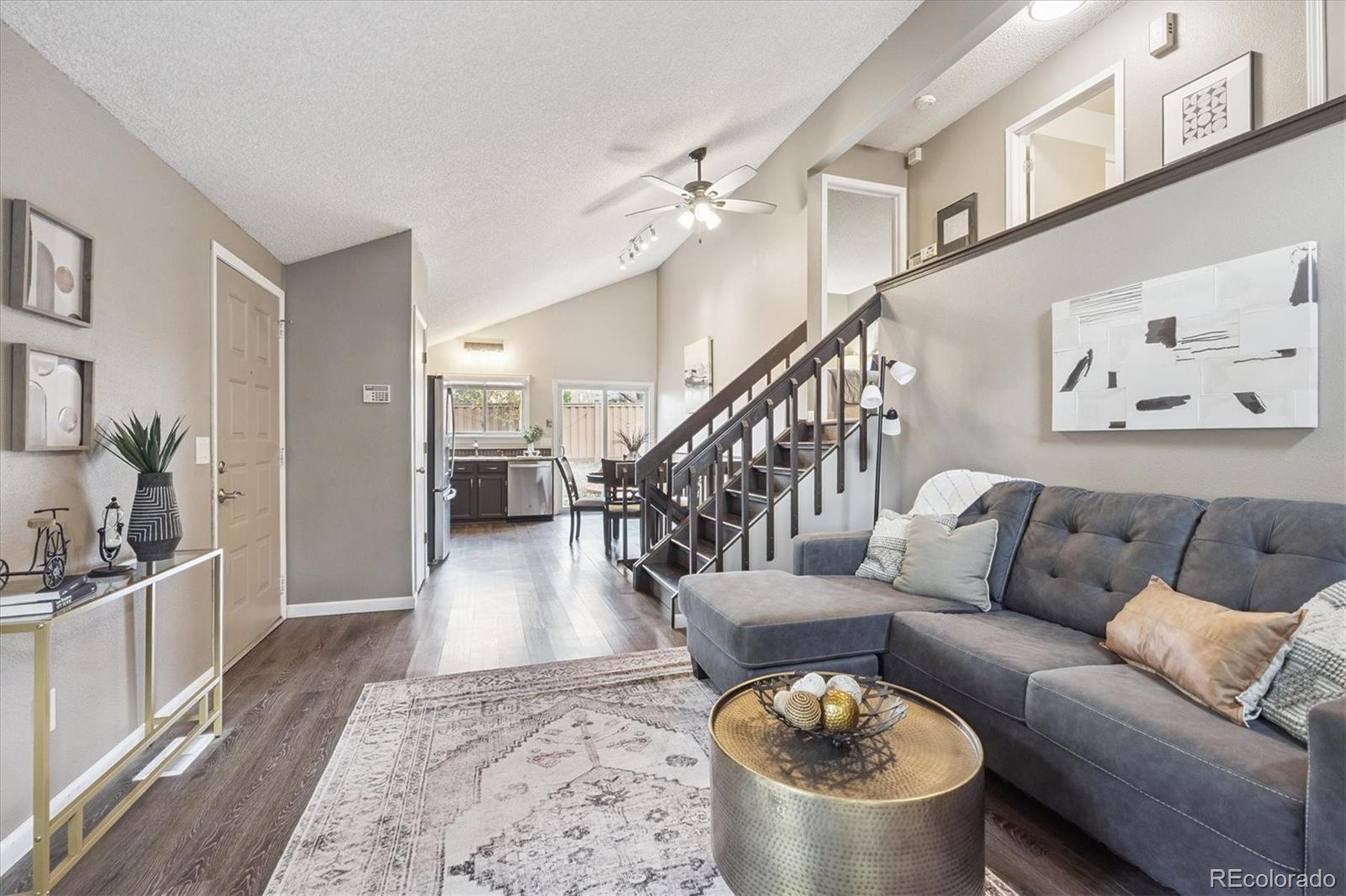 a living room with furniture and a rug