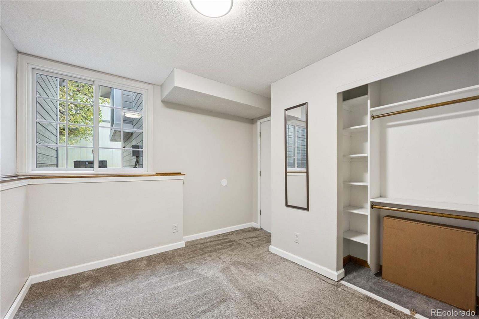 669 Walden Court Highlands Ranch, CO 80126 - Photo 12 of 34 a view of an empty room with window