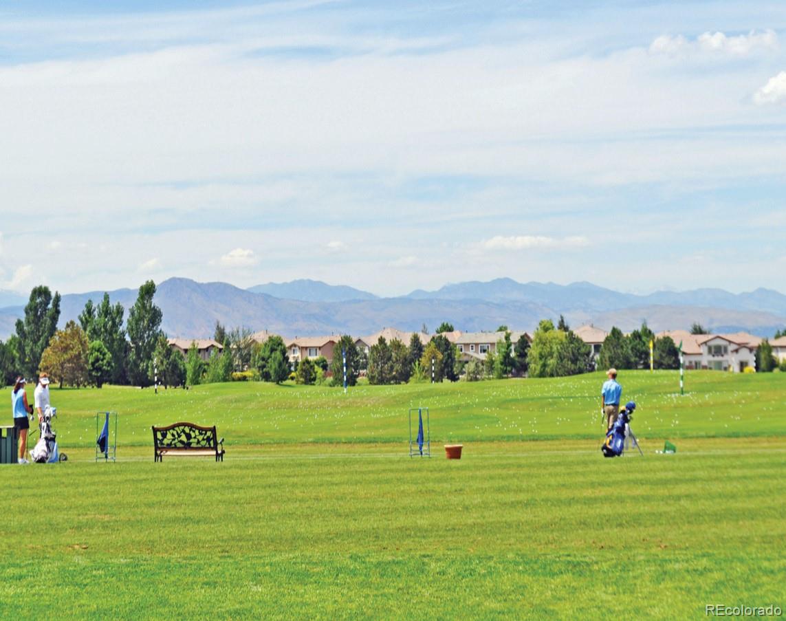 669 Walden Court Highlands Ranch, CO 80126 - Photo 28 of 34 a view of a grassy field with trees