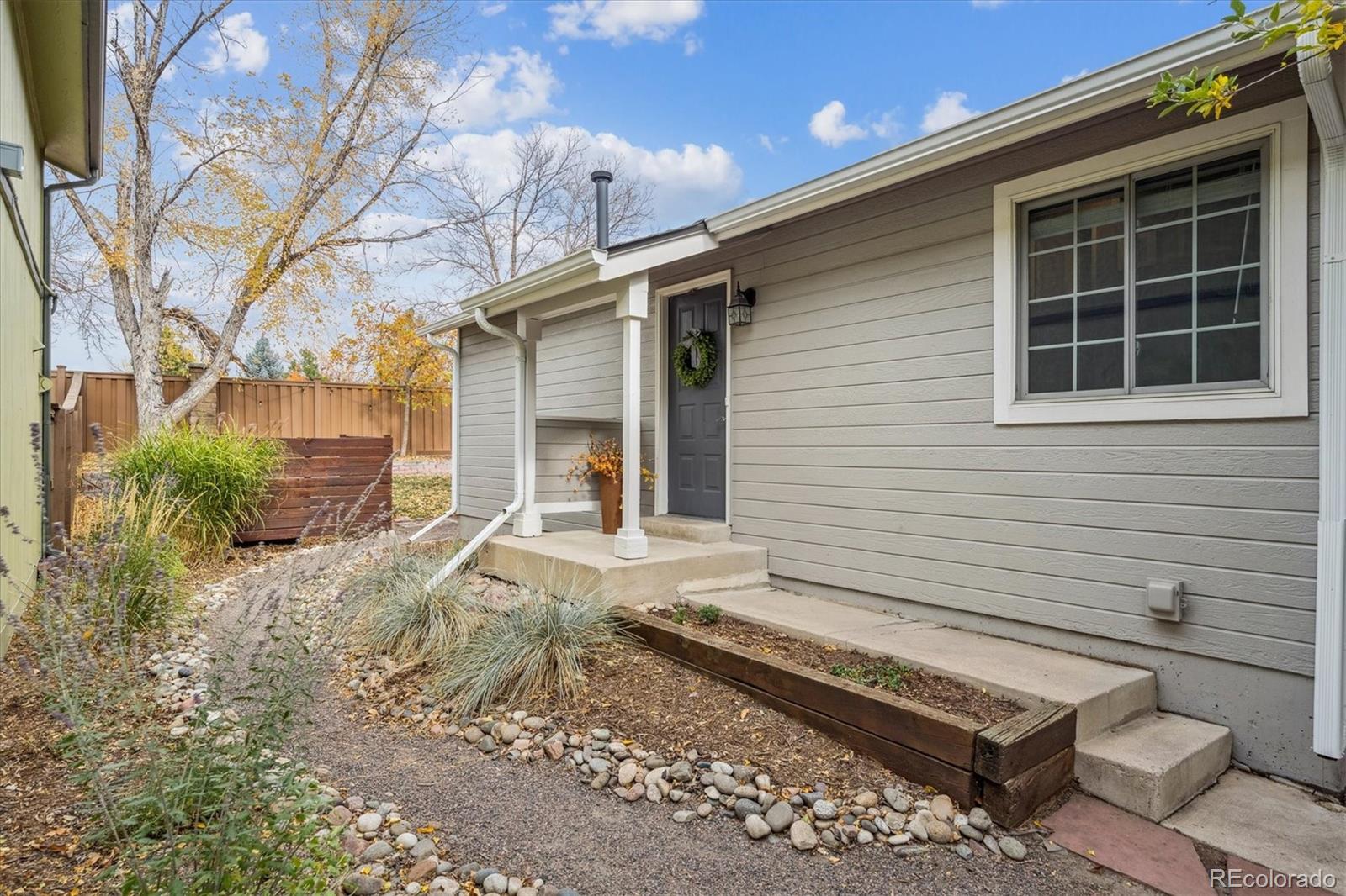 669 Walden Court Highlands Ranch, CO 80126 - Photo 3 of 34 a view of a house with a yard and sitting area