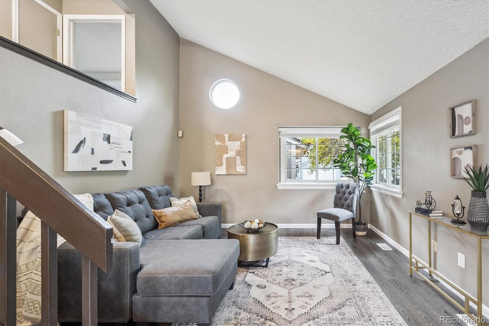 669 Walden Court Highlands Ranch, CO 80126 - Photo 4 of 34 a living room with furniture and a large window