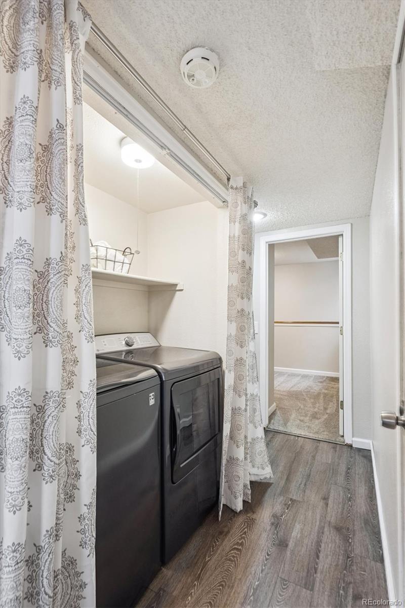 669 Walden Court Highlands Ranch, CO 80126 - Photo 10 of 34 a view of empty room with wooden floor