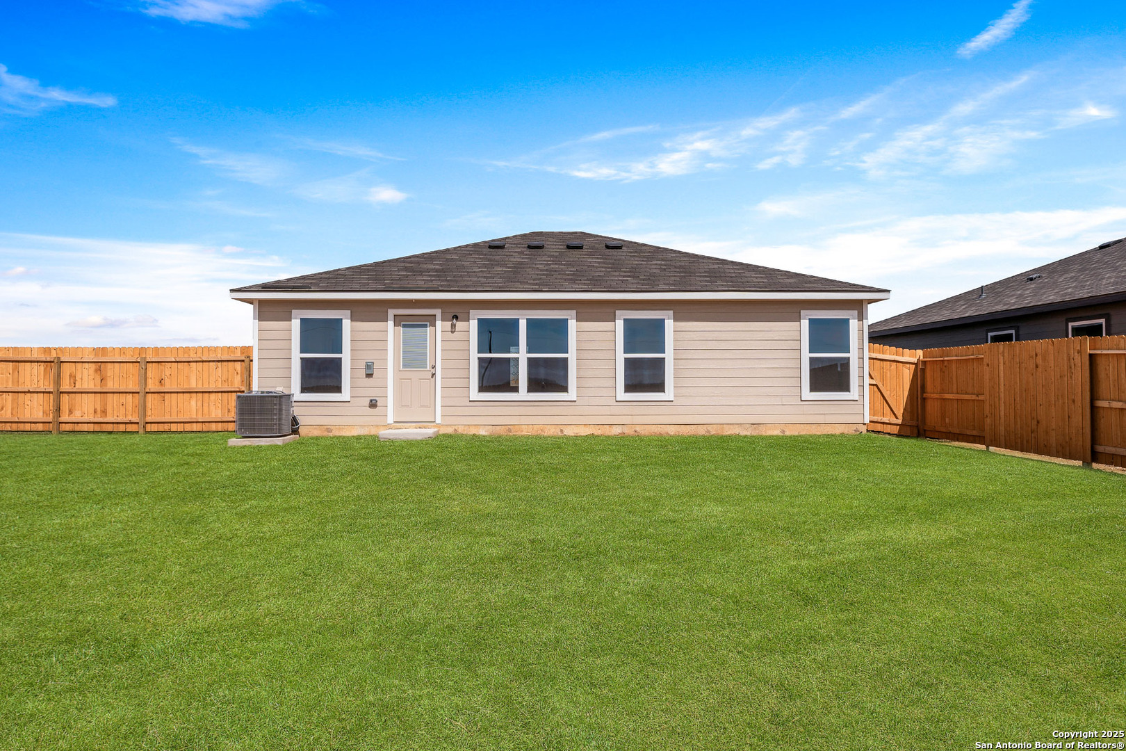 16108 Farmer Lytle, TX 78052 - Photo 2 of 27 a front view of a house with a garden