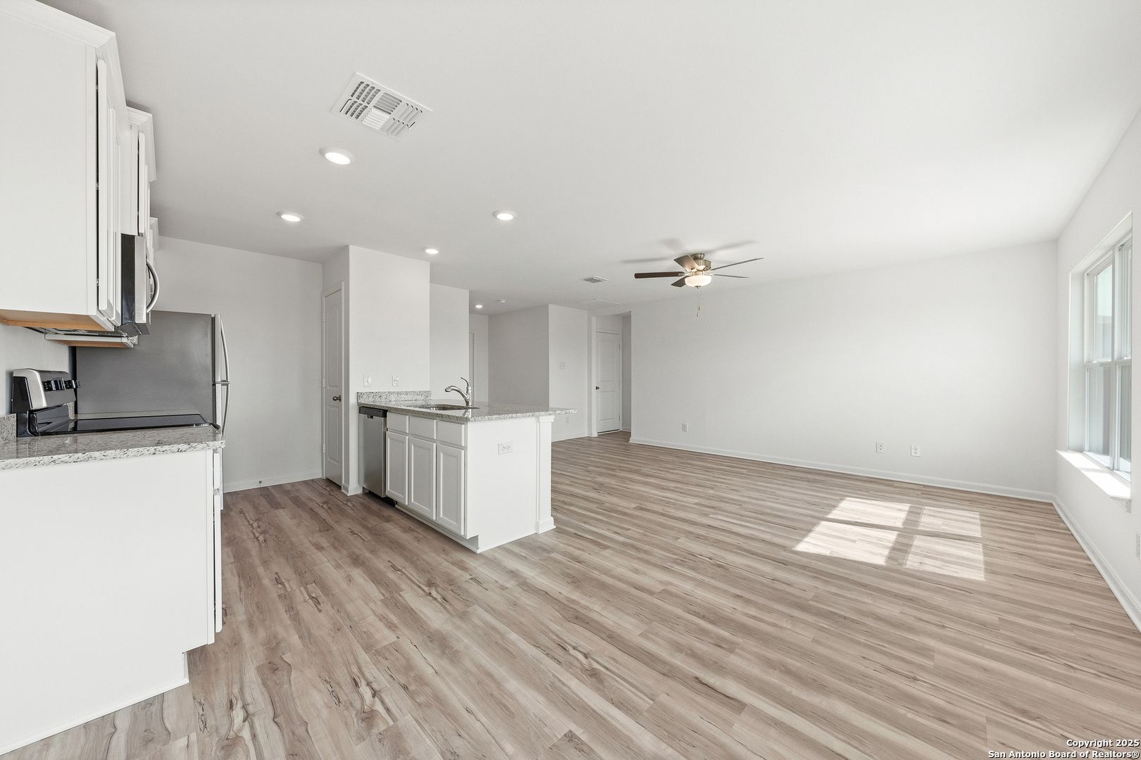 16108 Farmer Lytle, TX 78052 - Photo 8 of 27 a view of kitchen with sink and refrigerator