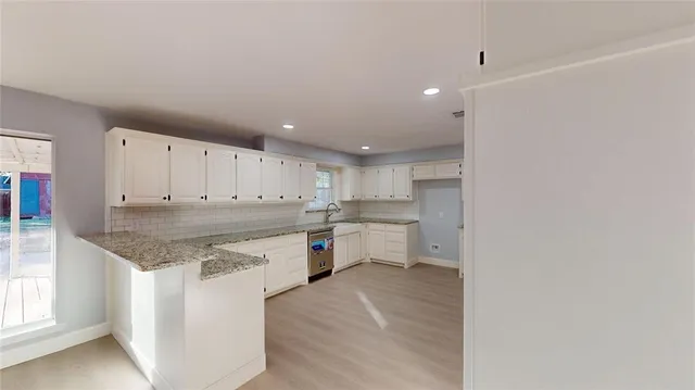 a kitchen with a sink and cabinets