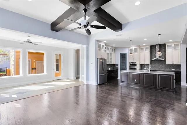 a view of a kitchen with a stove cabinets and wooden floor