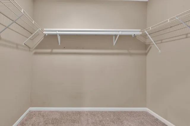 a view of an empty walk in closet