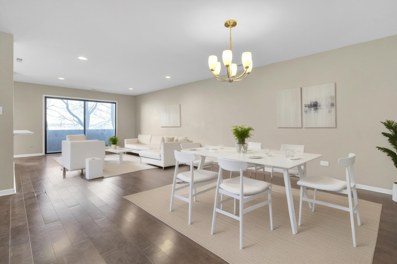 9242 Gross Point Road, Unit 310 Skokie, IL 60077 - Photo 4 of 18 a view of a dining room with furniture wooden floor and chandelier