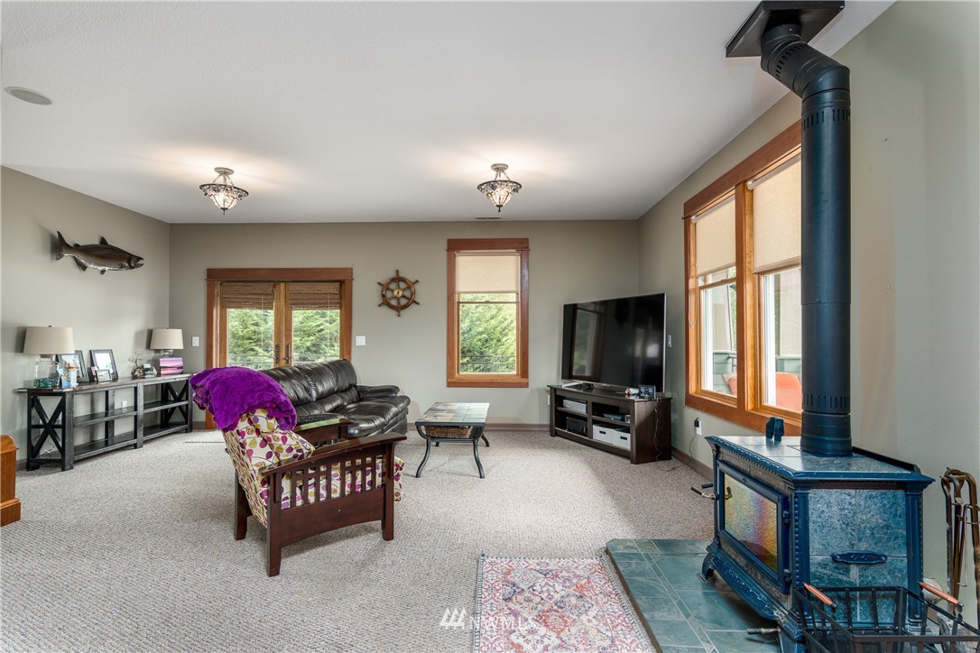 6845 Willow Grove Road Longview, WA 98632 - Photo 11 of 30 a living room with furniture fireplace and flat screen tv