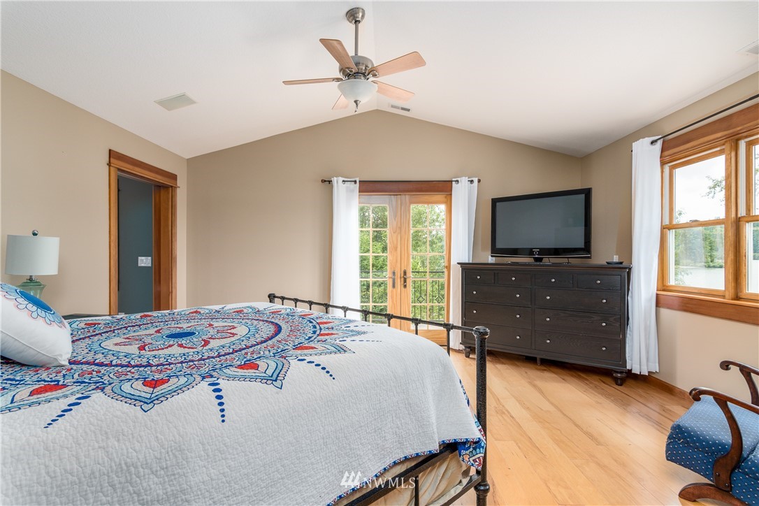 6845 Willow Grove Road Longview, WA 98632 - Photo 12 of 30 a bedroom with a bed and a flat screen tv