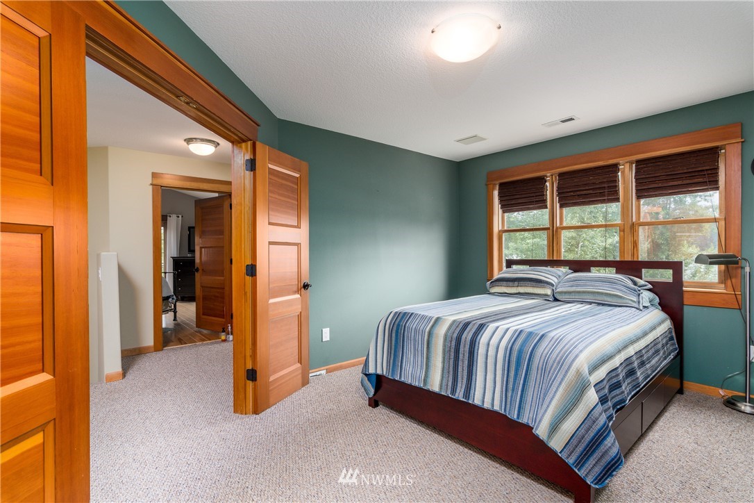 6845 Willow Grove Road Longview, WA 98632 - Photo 16 of 30 a bedroom with a bed and a large window