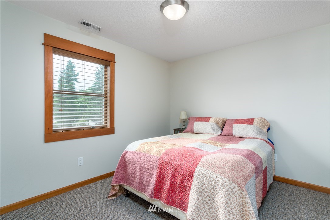 6845 Willow Grove Road Longview, WA 98632 - Photo 21 of 30 a bedroom with a bed and window