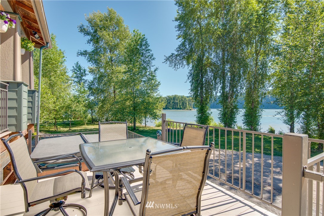 6845 Willow Grove Road Longview, WA 98632 - Photo 22 of 30 a view of a patio with a table and chairs