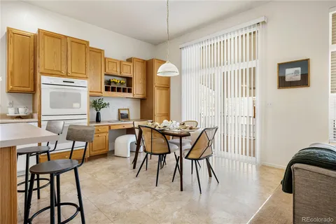 a view of a dining room with furniture and a window