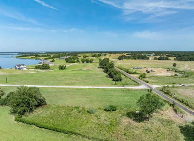 a view of a field with an ocean