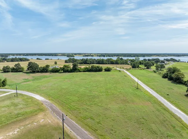 a view of a lake with a yard