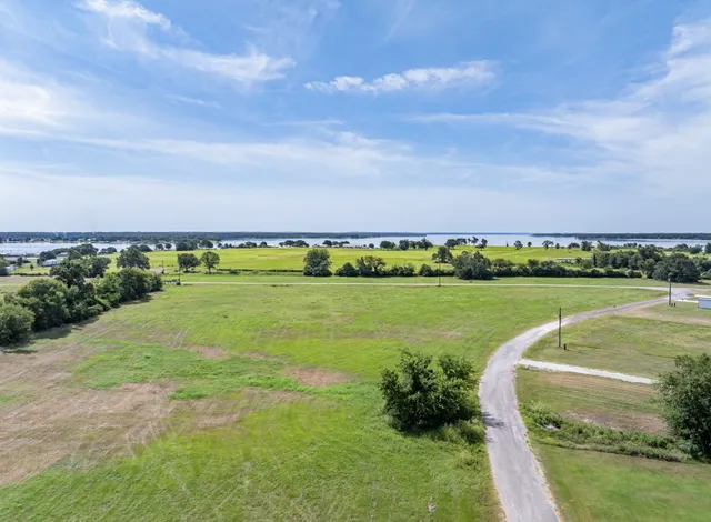 a view of a golf course with a lake