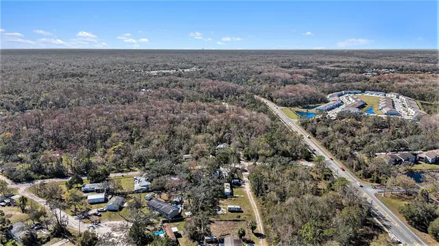 an aerial view of house with yard