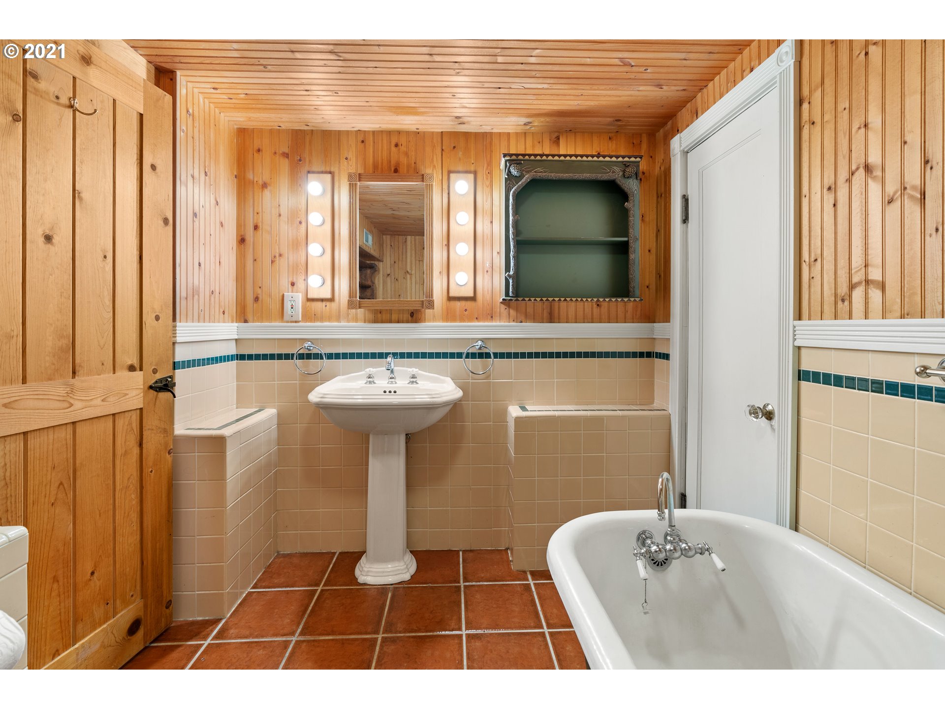 3740 Southwest Caldew Street Portland, OR 97219 - Photo 14 of 28 a bathroom with a sink a mirror and a shower
