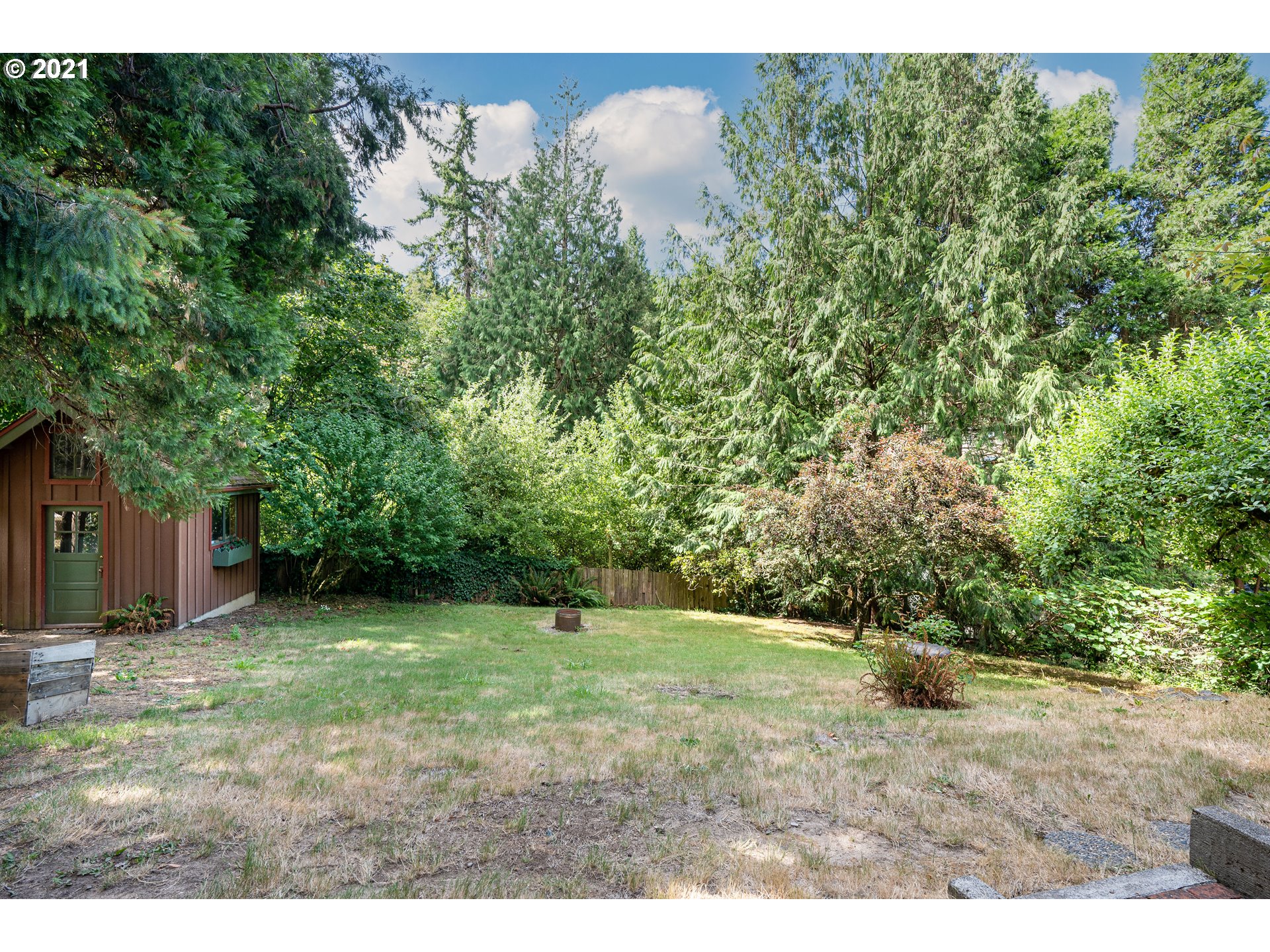 3740 Southwest Caldew Street Portland, OR 97219 - Photo 24 of 28 a view of a yard with a tree