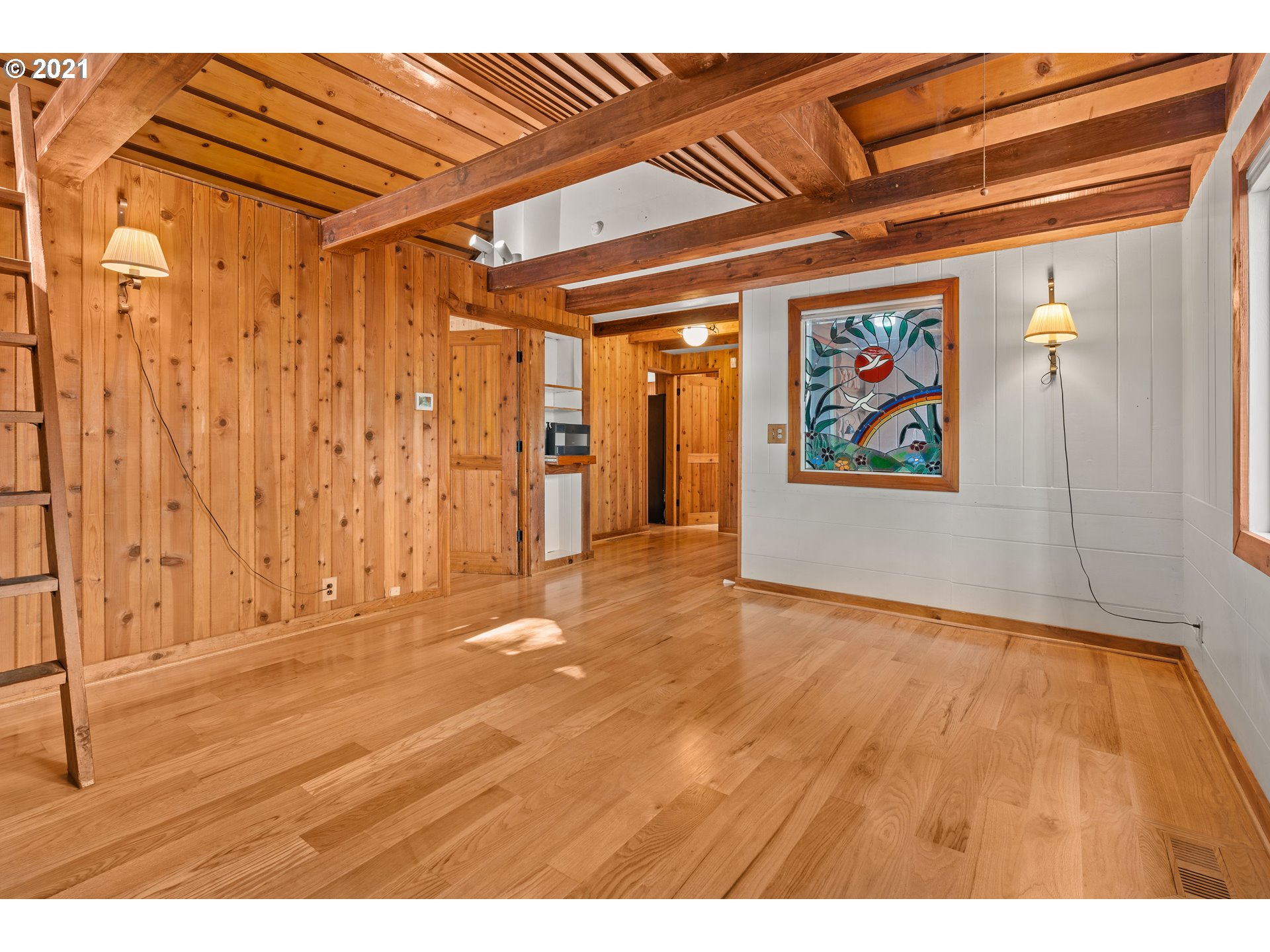 3740 Southwest Caldew Street Portland, OR 97219 - Photo 6 of 28 a view of an empty room with painting on the wall