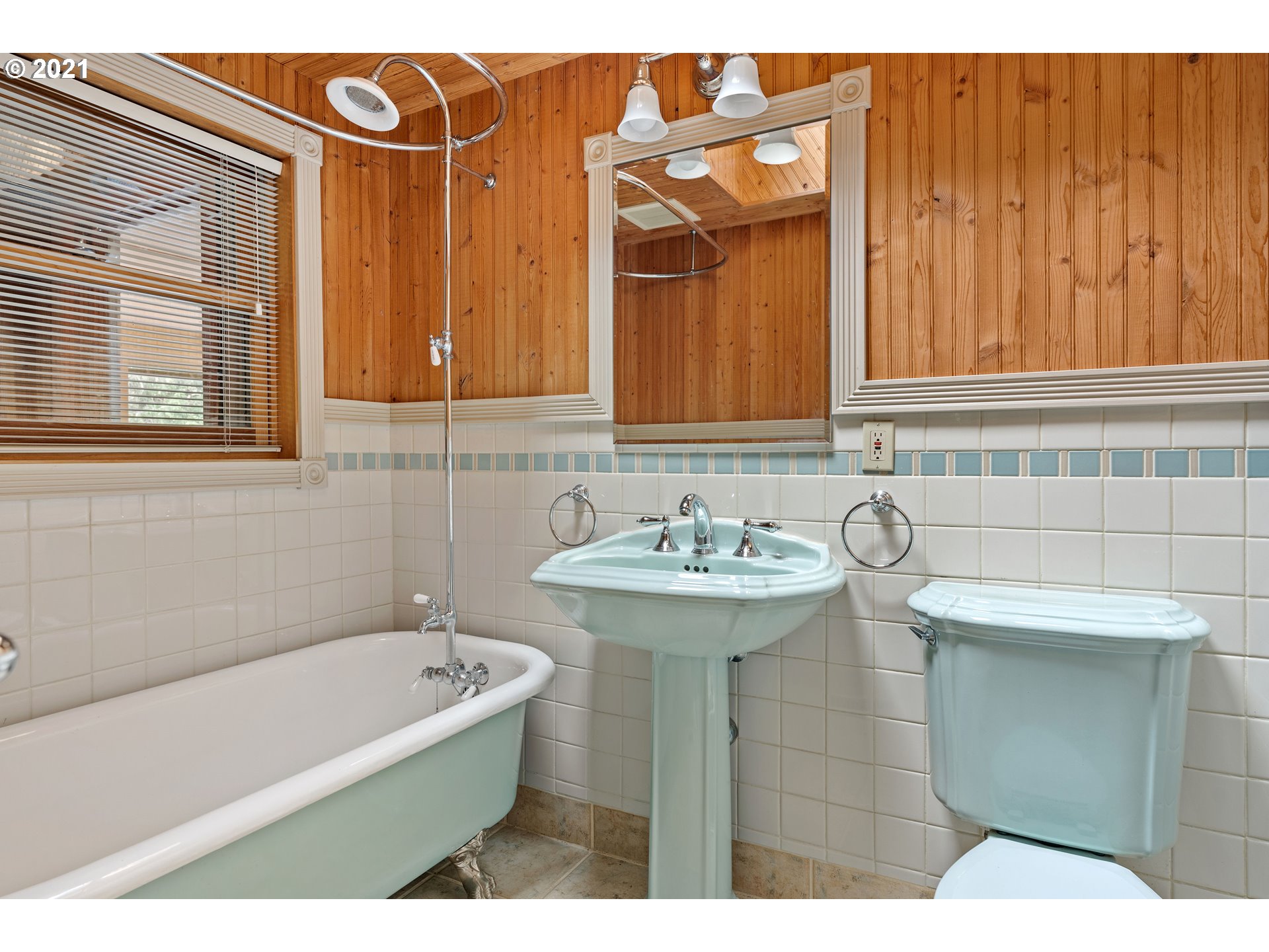 3740 Southwest Caldew Street Portland, OR 97219 - Photo 9 of 28 a bathroom with a sink a bathtub and a shower
