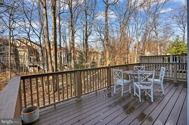 a view of balcony with furniture and wooden floor
