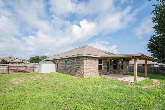 a backyard of a house with lots of green space