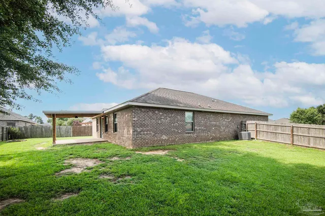 a view of a yard in front of a house