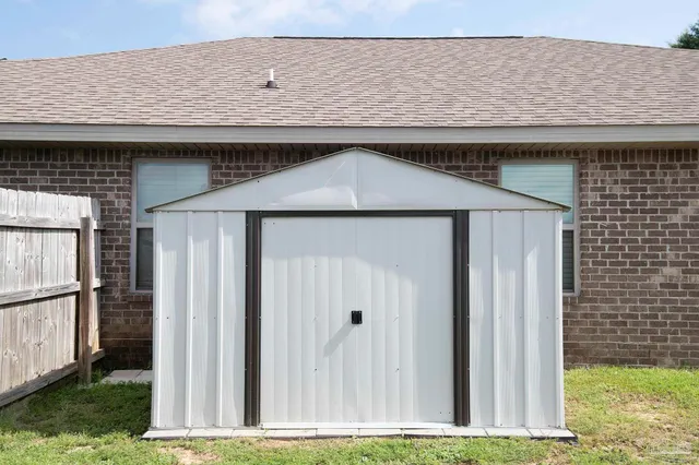 a house view with a wooden fencing
