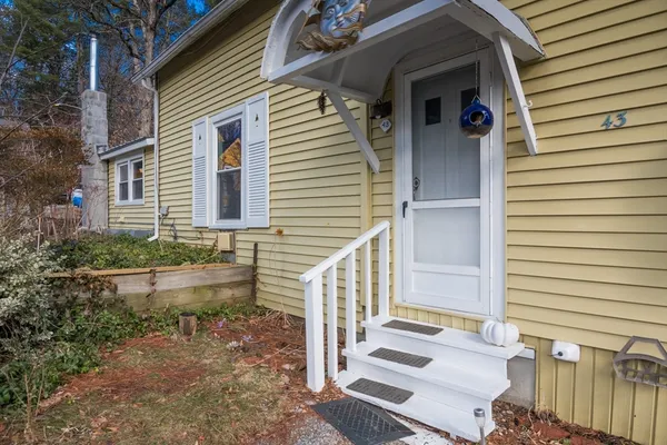 a front view of a house with stairs