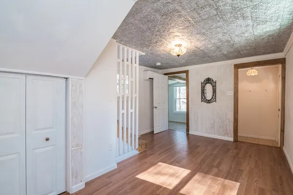 a view of entryway with wooden floor