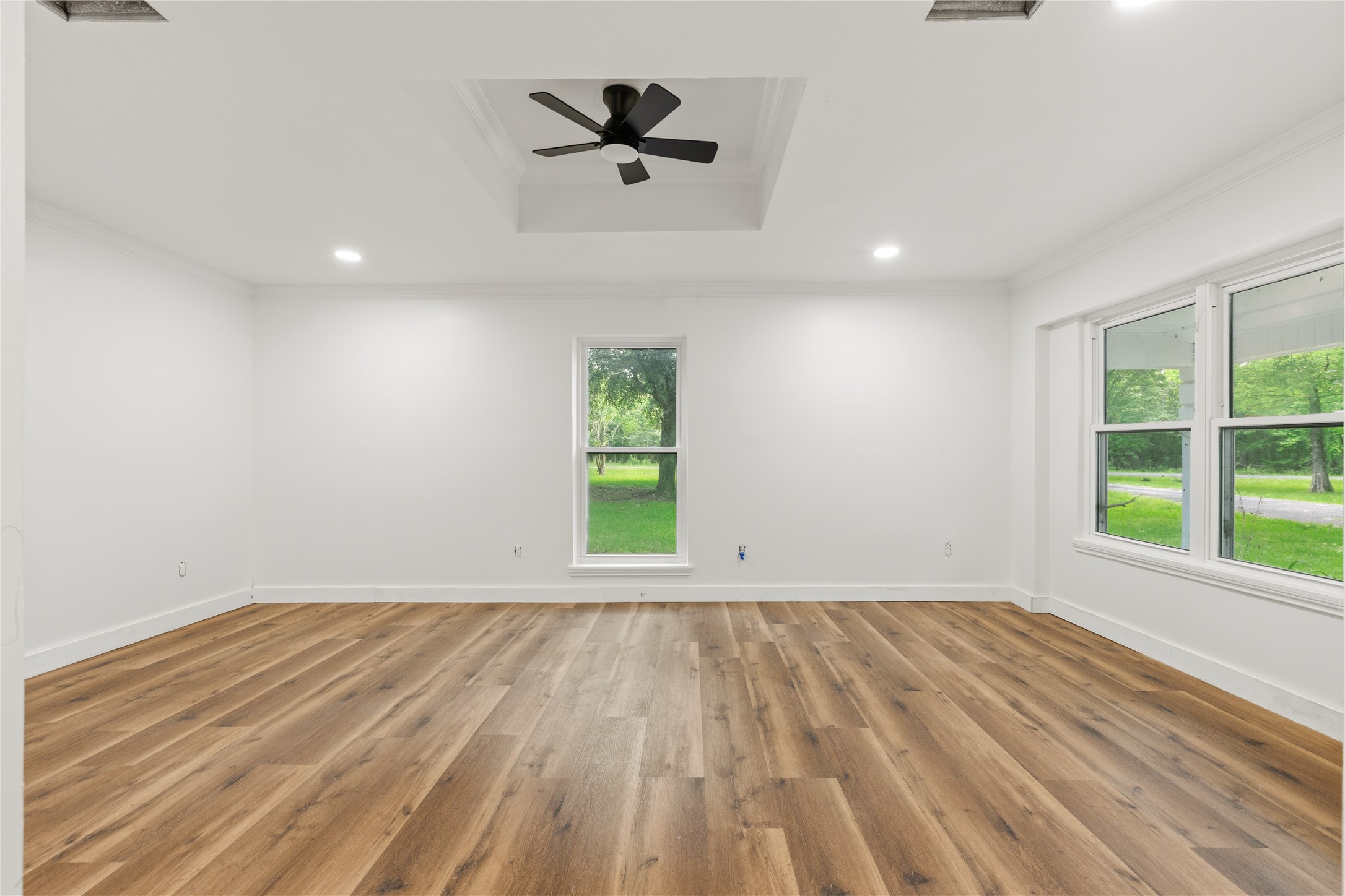 74 Robinson Road Huntsville, TX 77320 - Photo 16 of 33 wooden floor in an empty room with a window