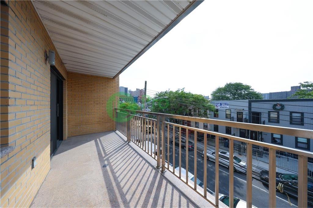 2837 West 19th Street, Unit 3B Brooklyn, NY 11224 - Photo 19 of 21 a view of a balcony with wooden floor and fence