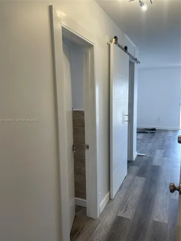 a kitchen with cabinets appliances a sink and a window