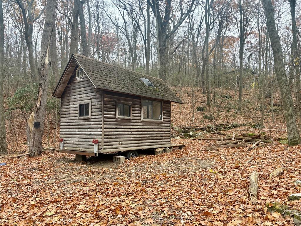 a view of house with a yard