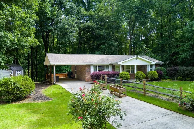 a view of a house with a yard porch and sitting area