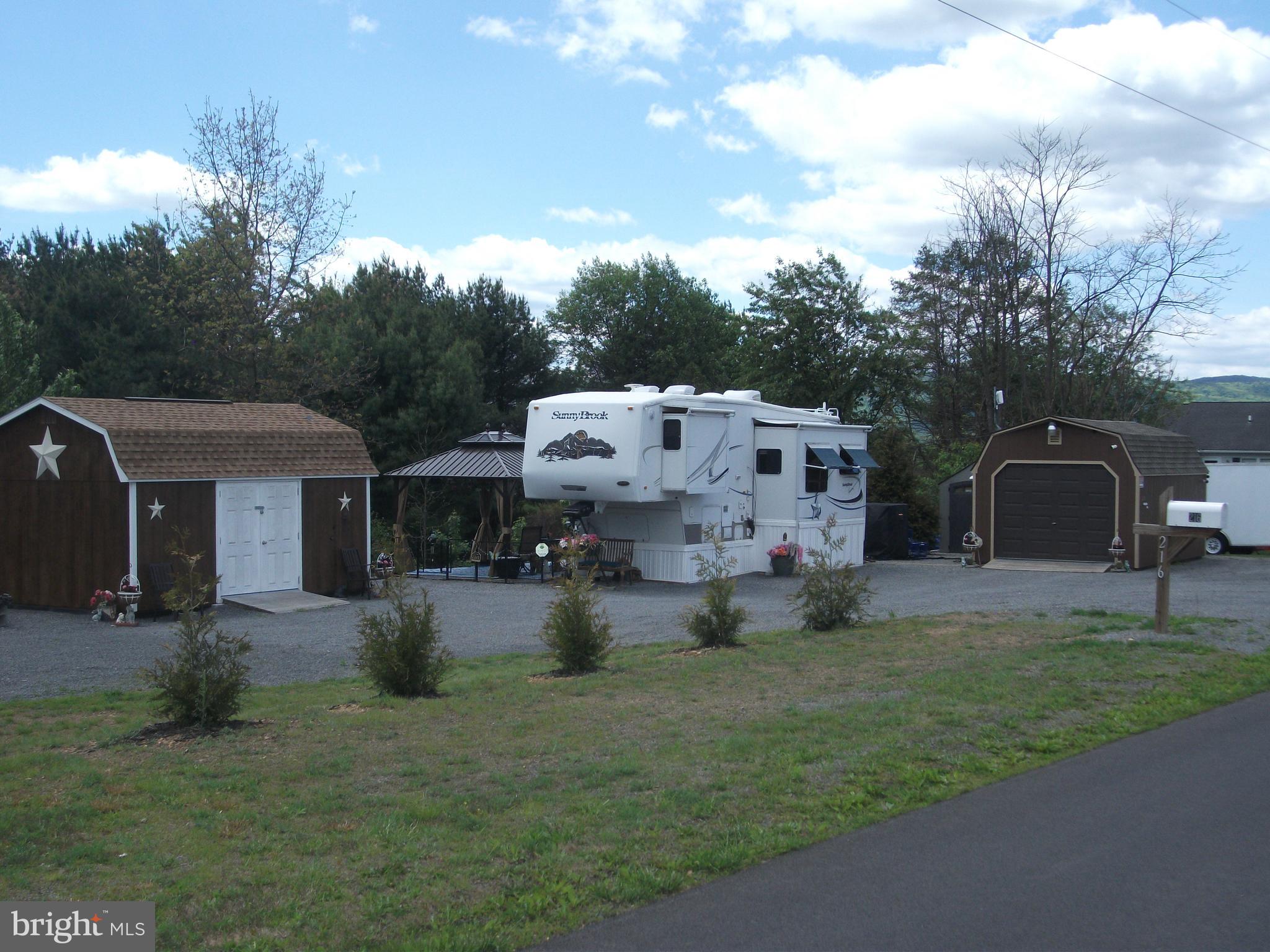 216 Garland Road Needmore, PA 17238 - Photo 1 of 38 a view of a house with backyard and sitting area