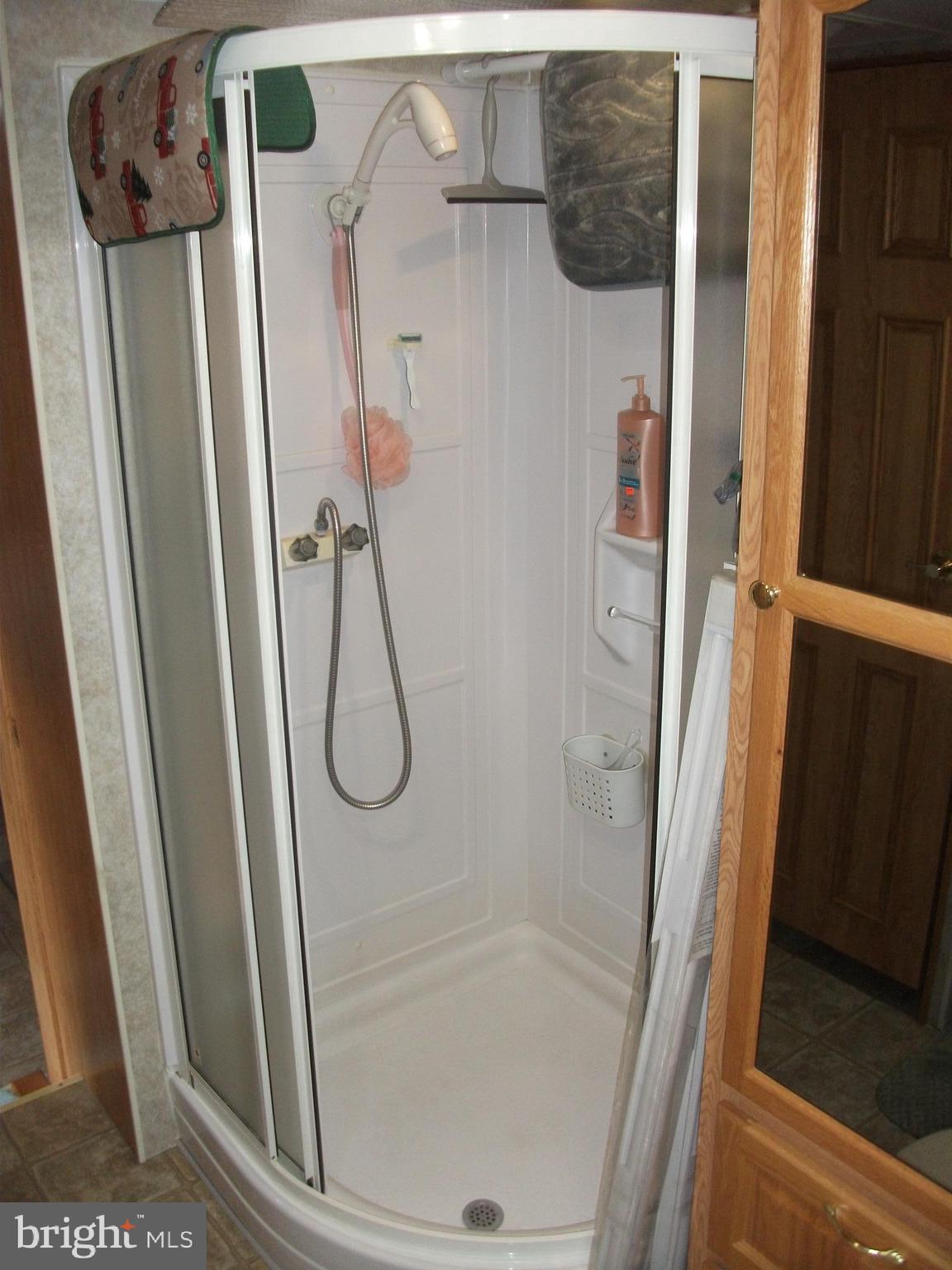216 Garland Road Needmore, PA 17238 - Photo 16 of 38 a bathroom with a glass shower door