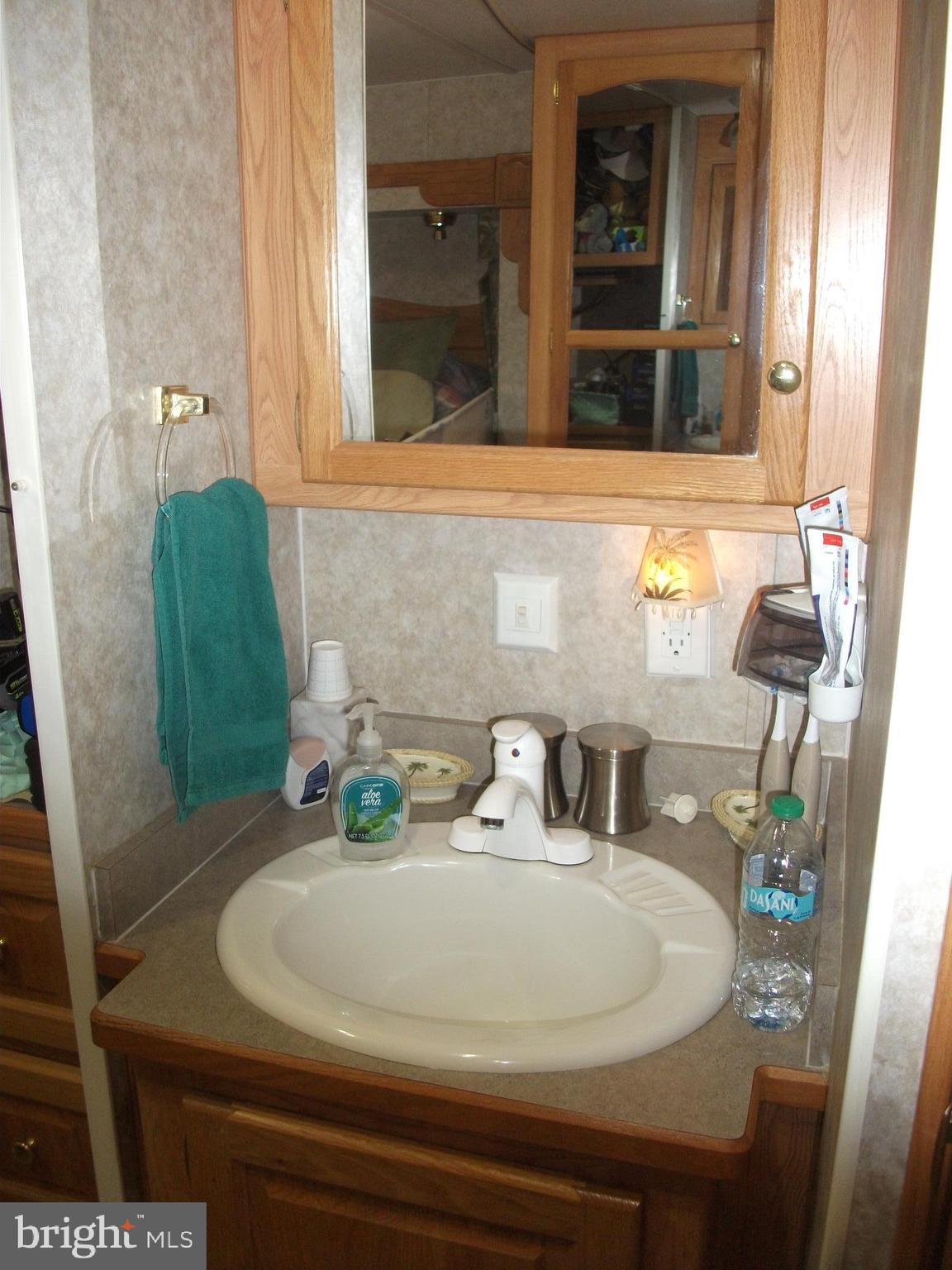216 Garland Road Needmore, PA 17238 - Photo 17 of 38 a bathroom with a sink and a mirror