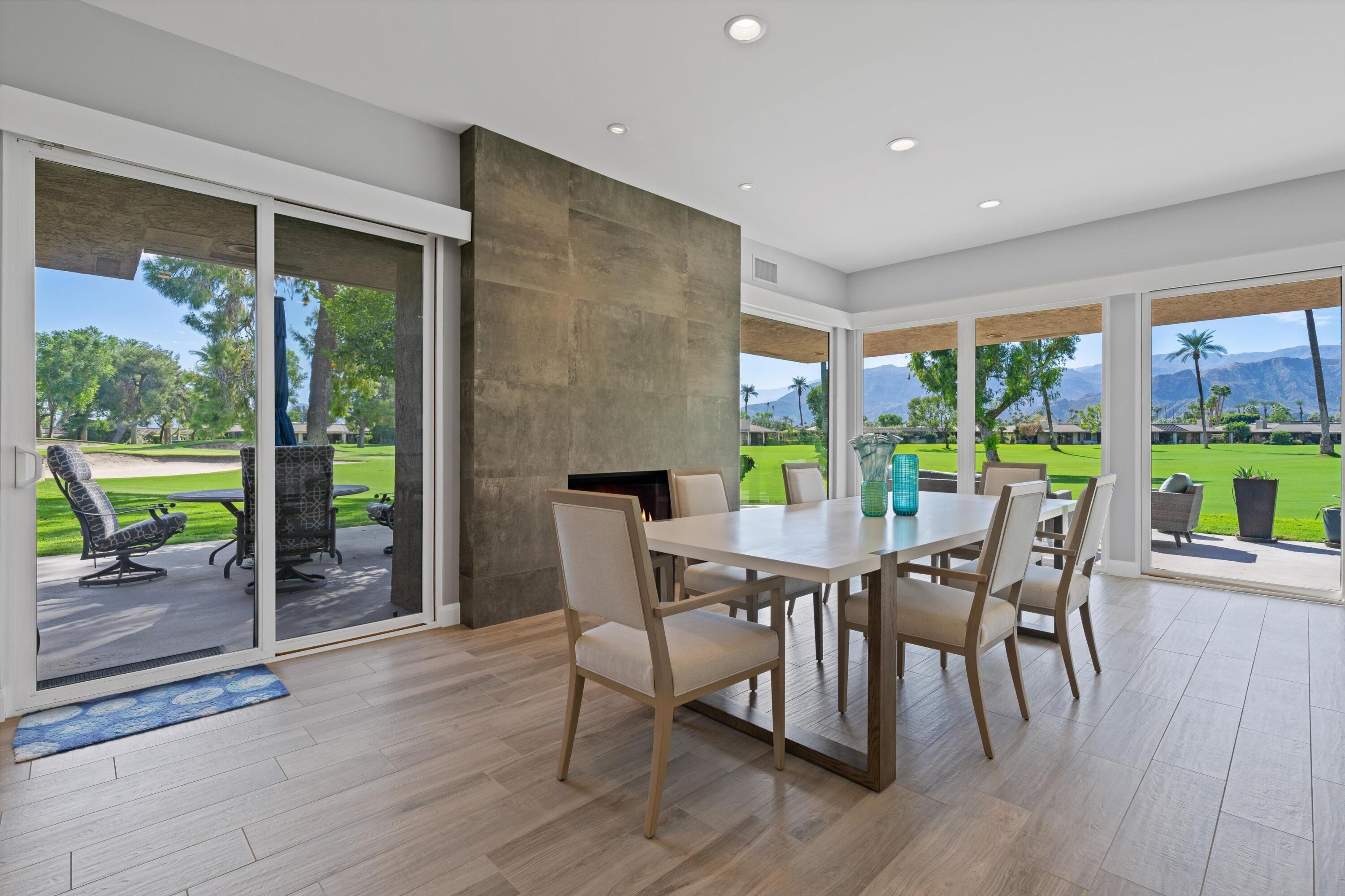 7 Wake Forest Court Rancho Mirage, CA 92270 - Photo 11 of 60 a dining room with furniture window and wooden floor