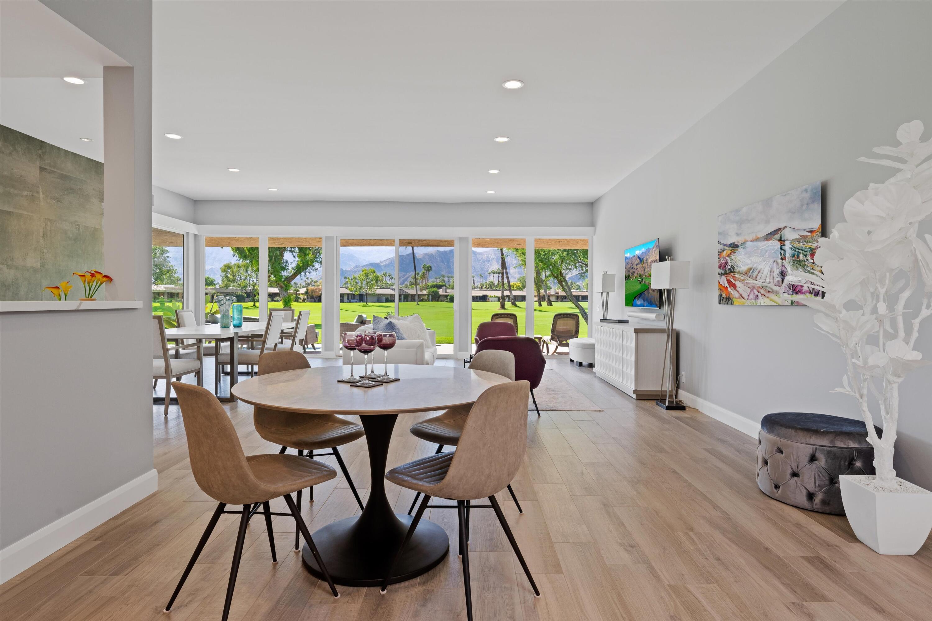 7 Wake Forest Court Rancho Mirage, CA 92270 - Photo 12 of 60 a view of a dining room with furniture and wooden floor