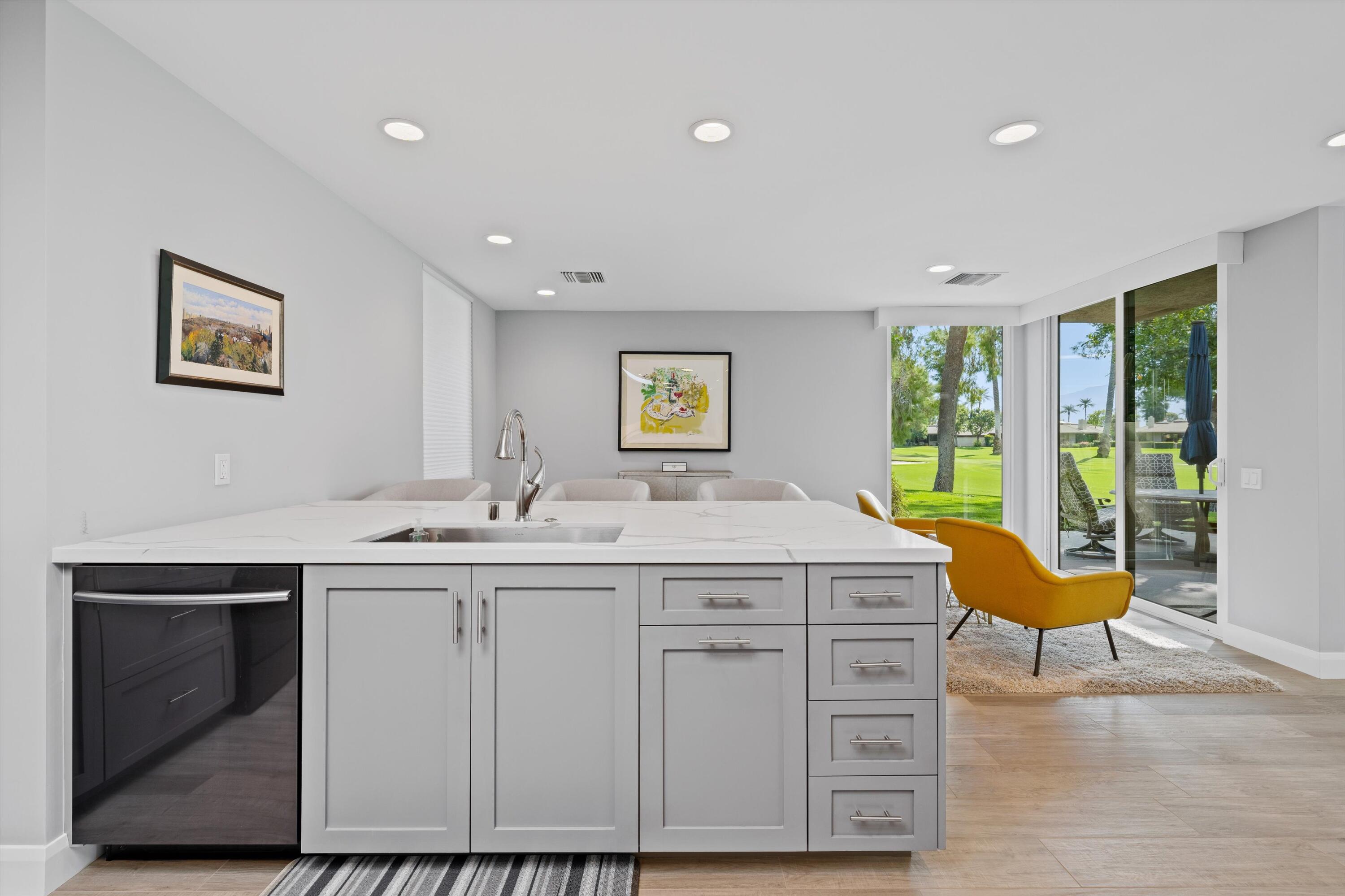 7 Wake Forest Court Rancho Mirage, CA 92270 - Photo 17 of 60 a view of cabinets with wooden floor and window
