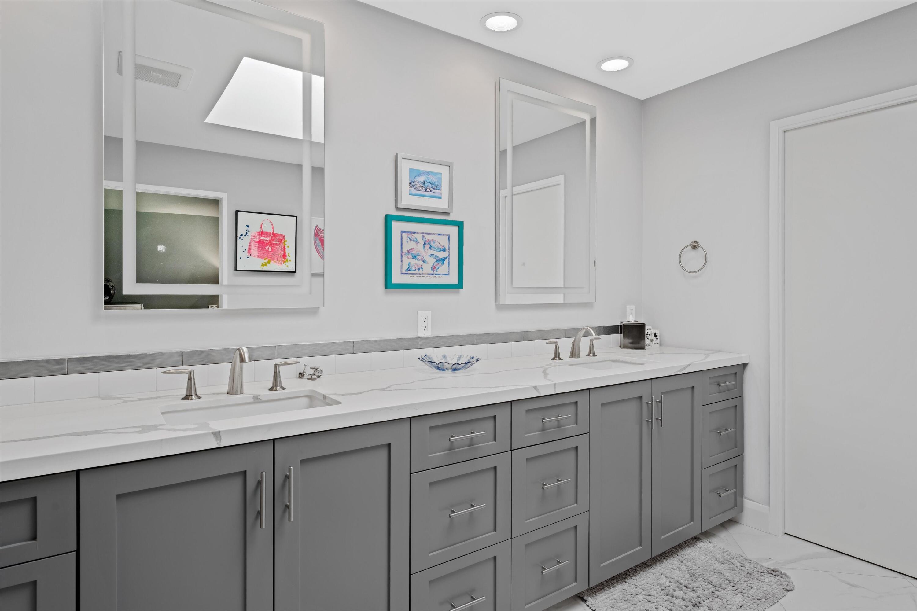 7 Wake Forest Court Rancho Mirage, CA 92270 - Photo 23 of 60 a bathroom with double sink and a mirror