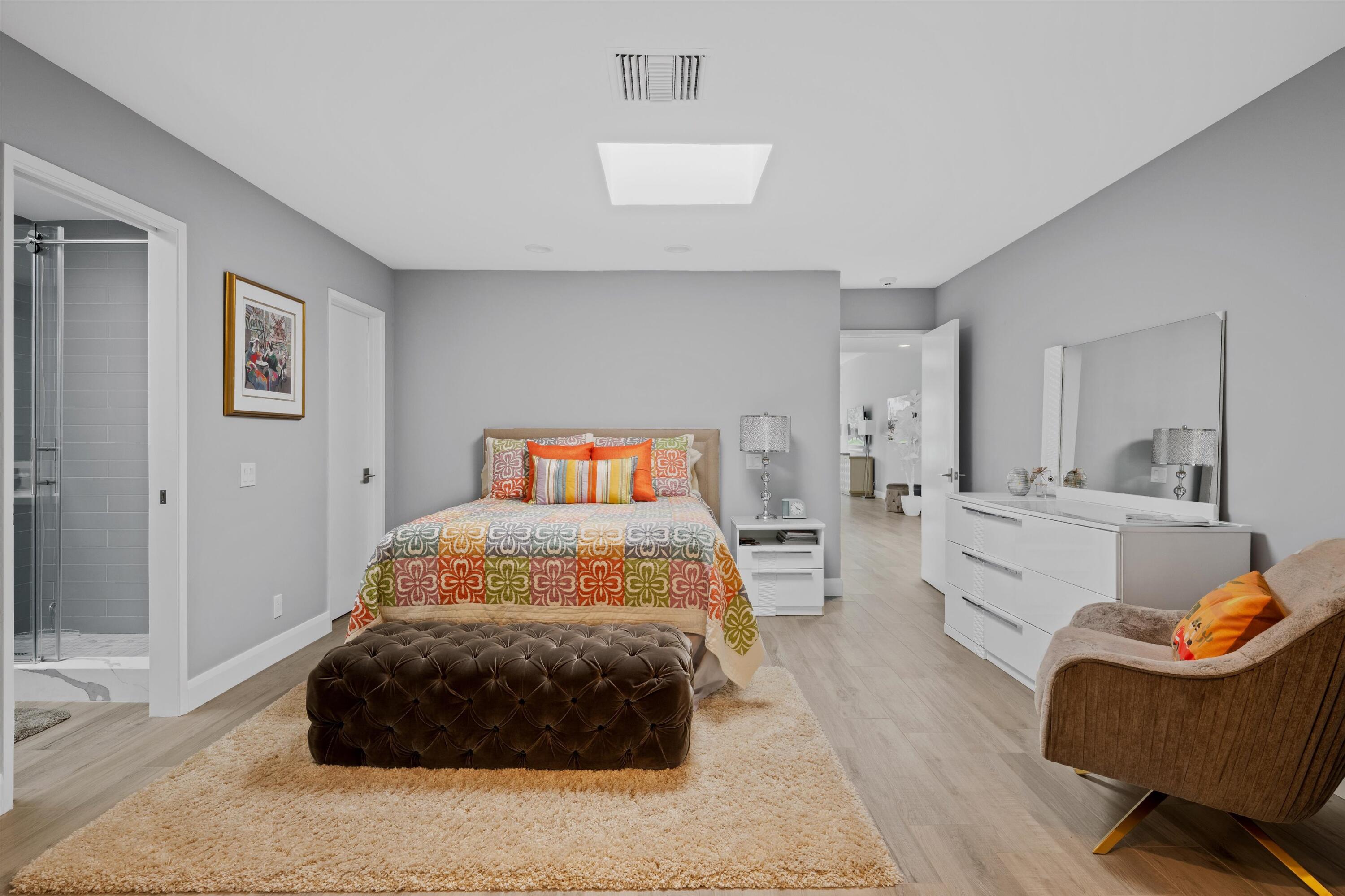 7 Wake Forest Court Rancho Mirage, CA 92270 - Photo 27 of 60 a bedroom with a bed and a couch