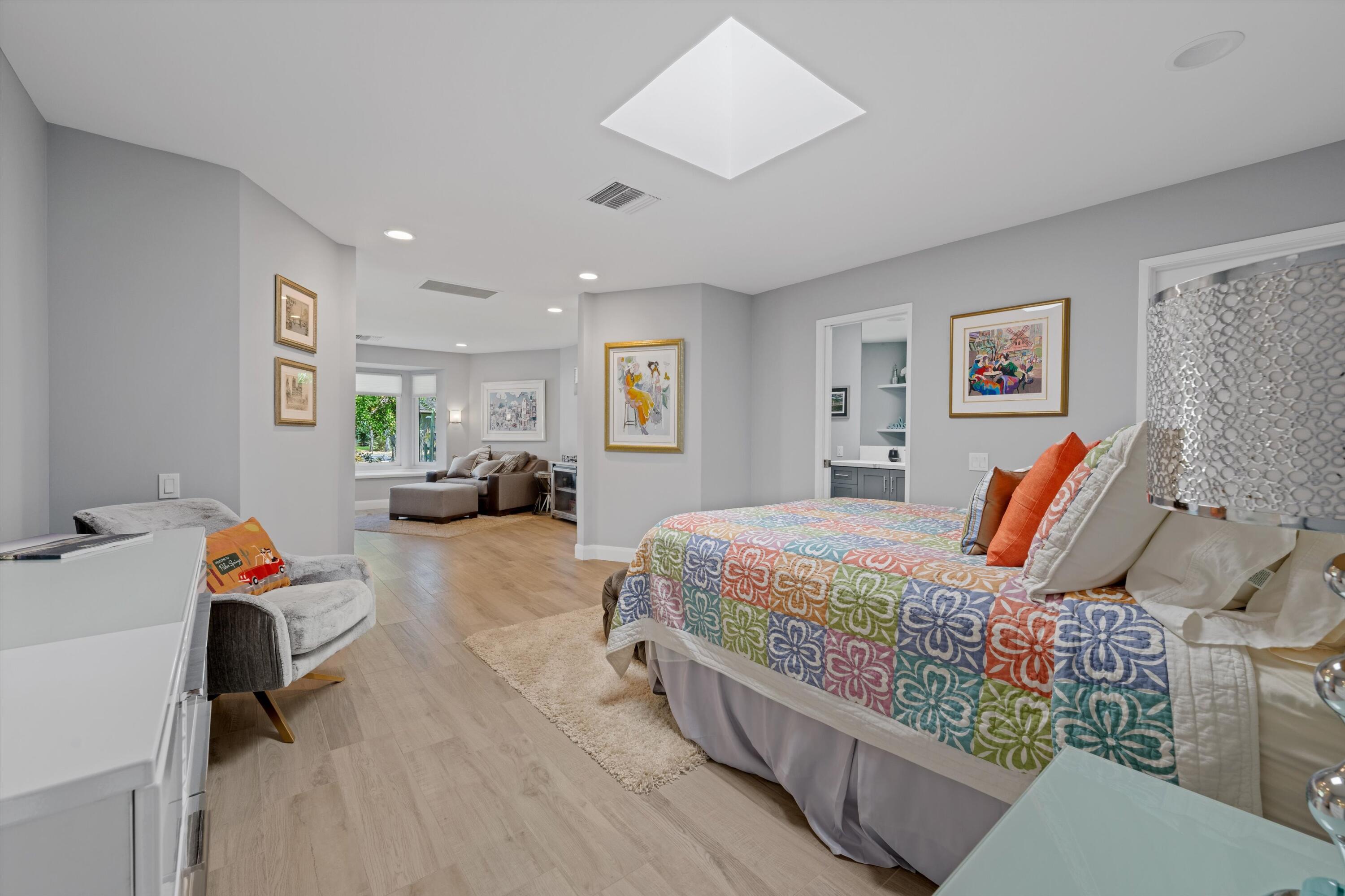 7 Wake Forest Court Rancho Mirage, CA 92270 - Photo 28 of 60 a bedroom with furniture and a wooden floor