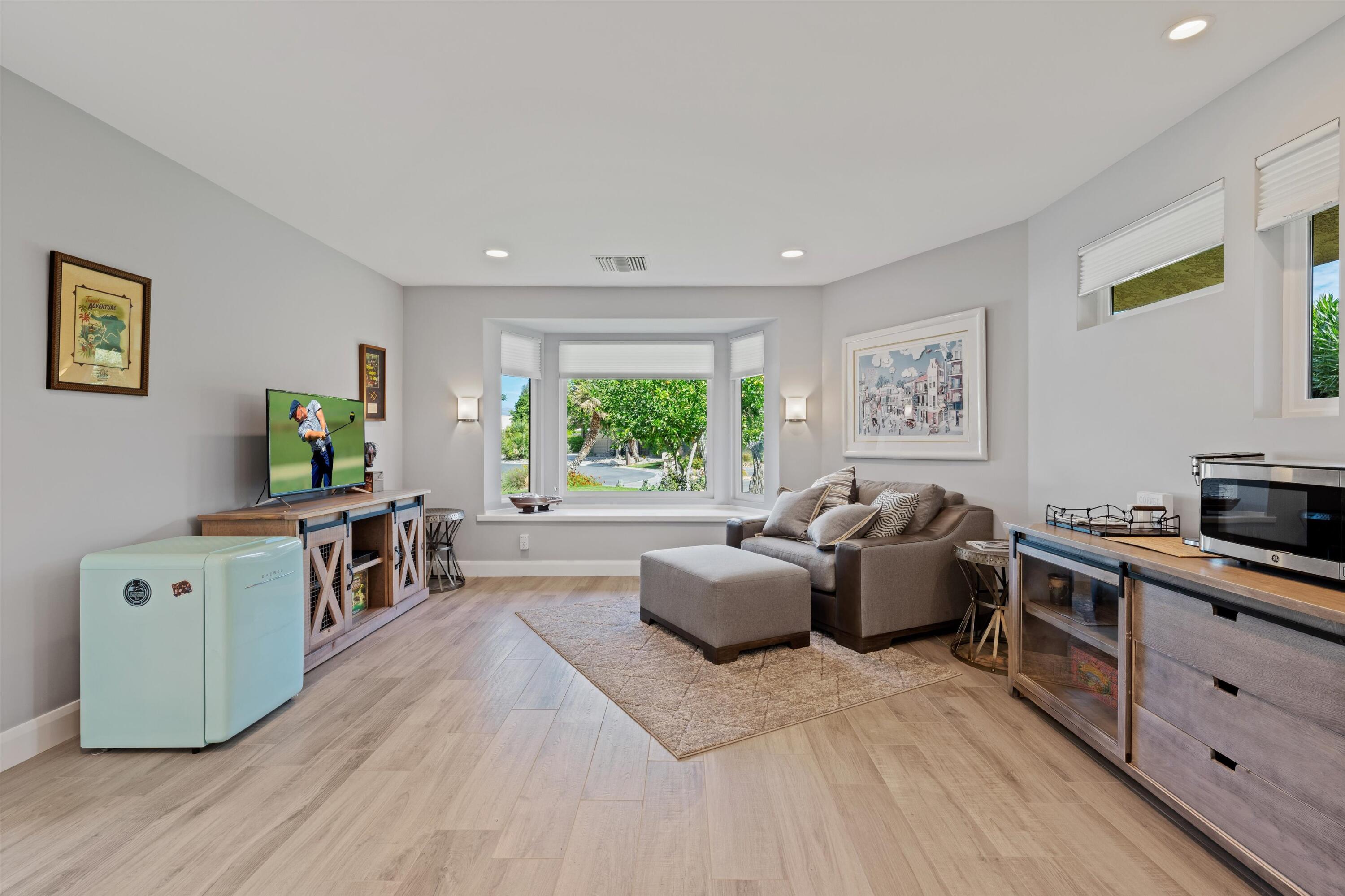 7 Wake Forest Court Rancho Mirage, CA 92270 - Photo 30 of 60 a living room with furniture and a window