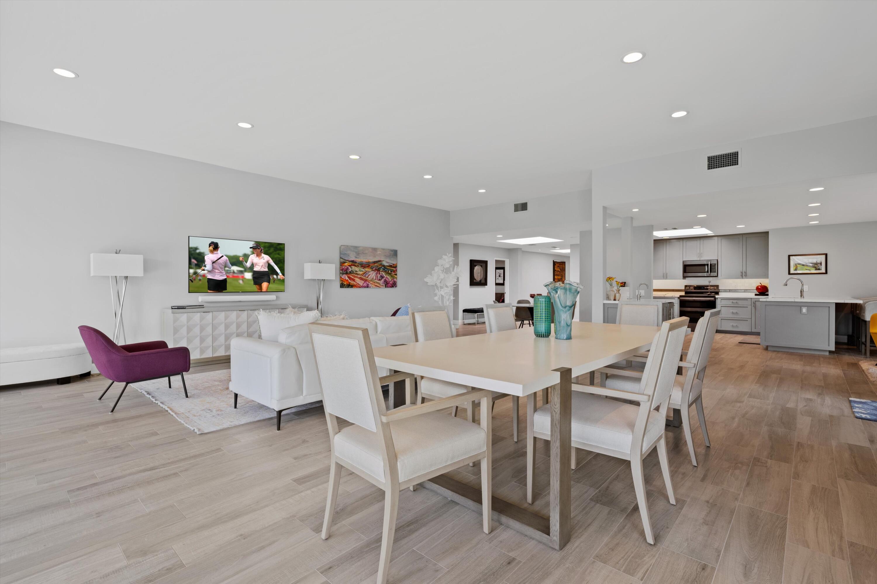 7 Wake Forest Court Rancho Mirage, CA 92270 - Photo 3 of 60 a view of a dining area with furniture and wooden floor