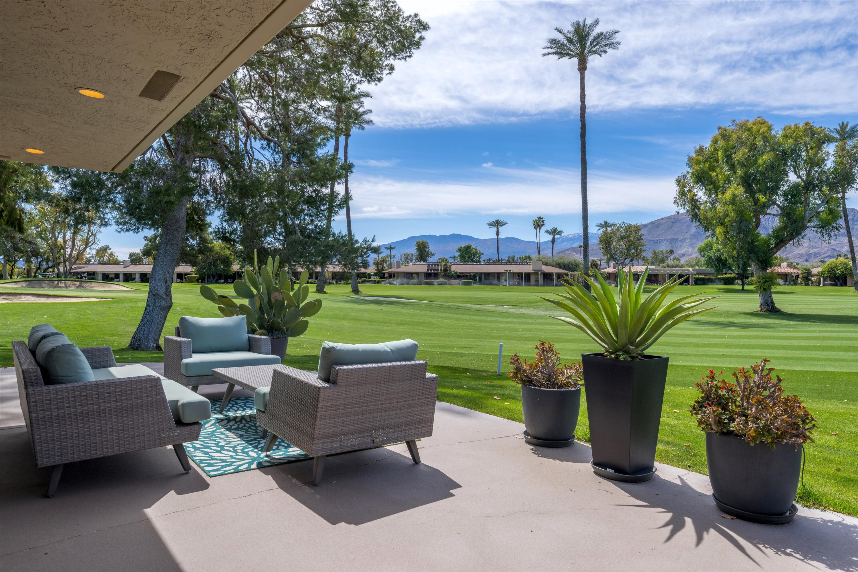 7 Wake Forest Court Rancho Mirage, CA 92270 - Photo 4 of 60 a garden view with a seating space and plants